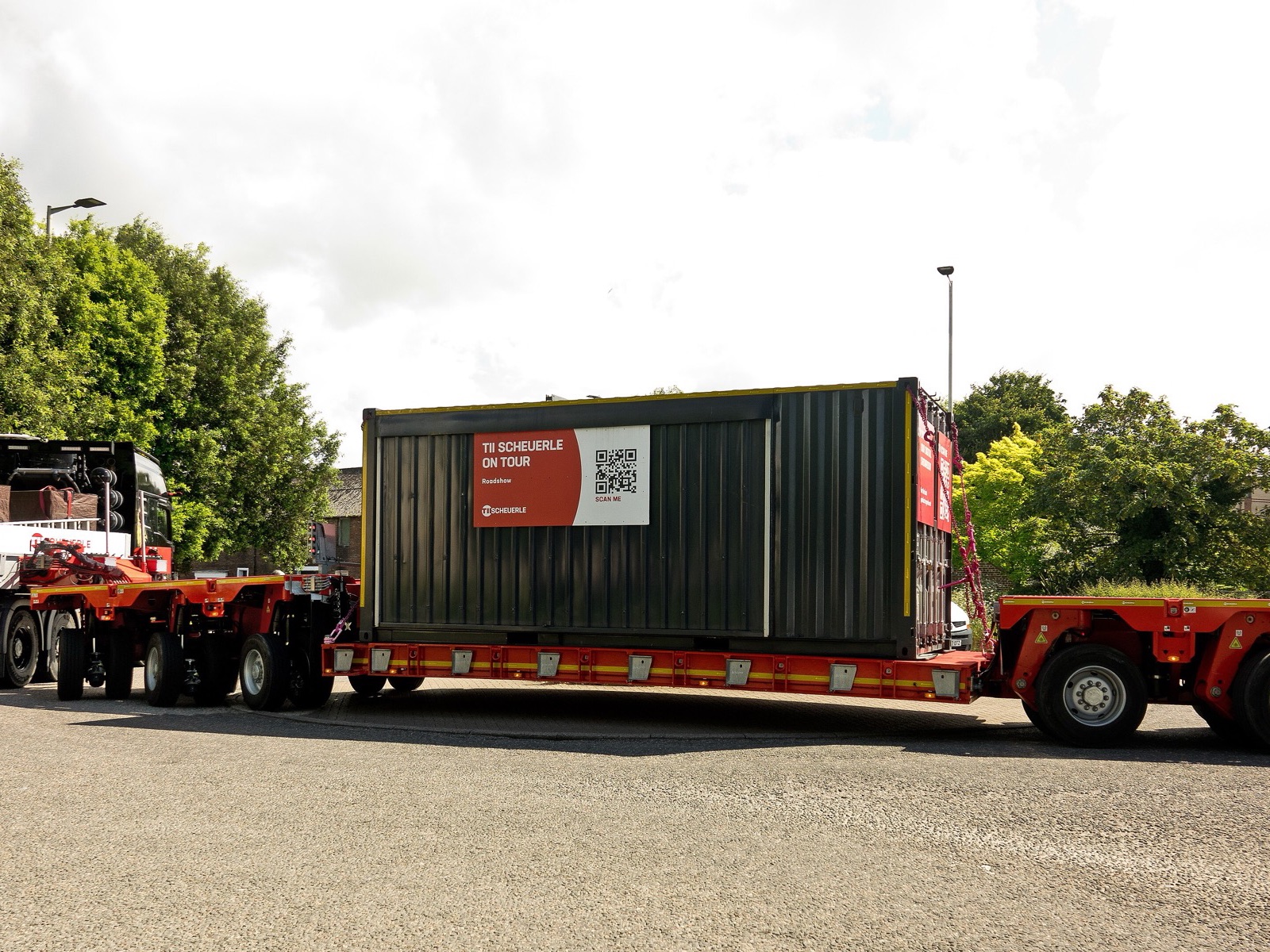 Heavy industrial equipment being moved at a project site